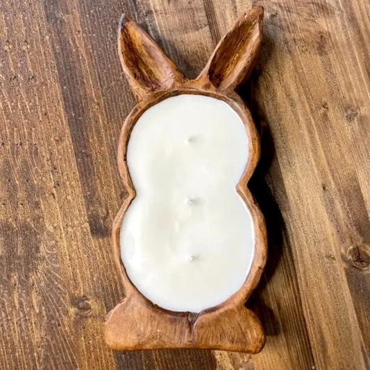 A three wick candle made in a bunny shaped dough bowl