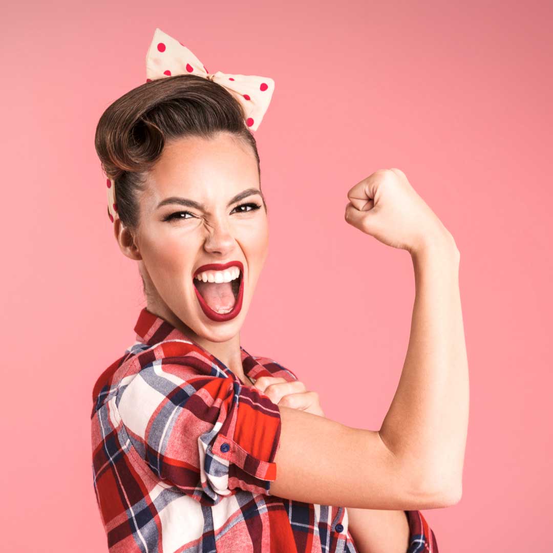 Photo of woman dressed as Rosie-the-Riveter, representing the American Businesswomen; shop local | LocalWe