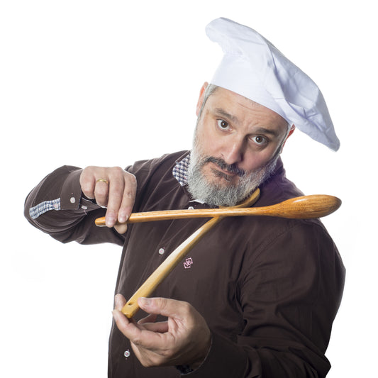Chef using his wooden spoons like a violin
