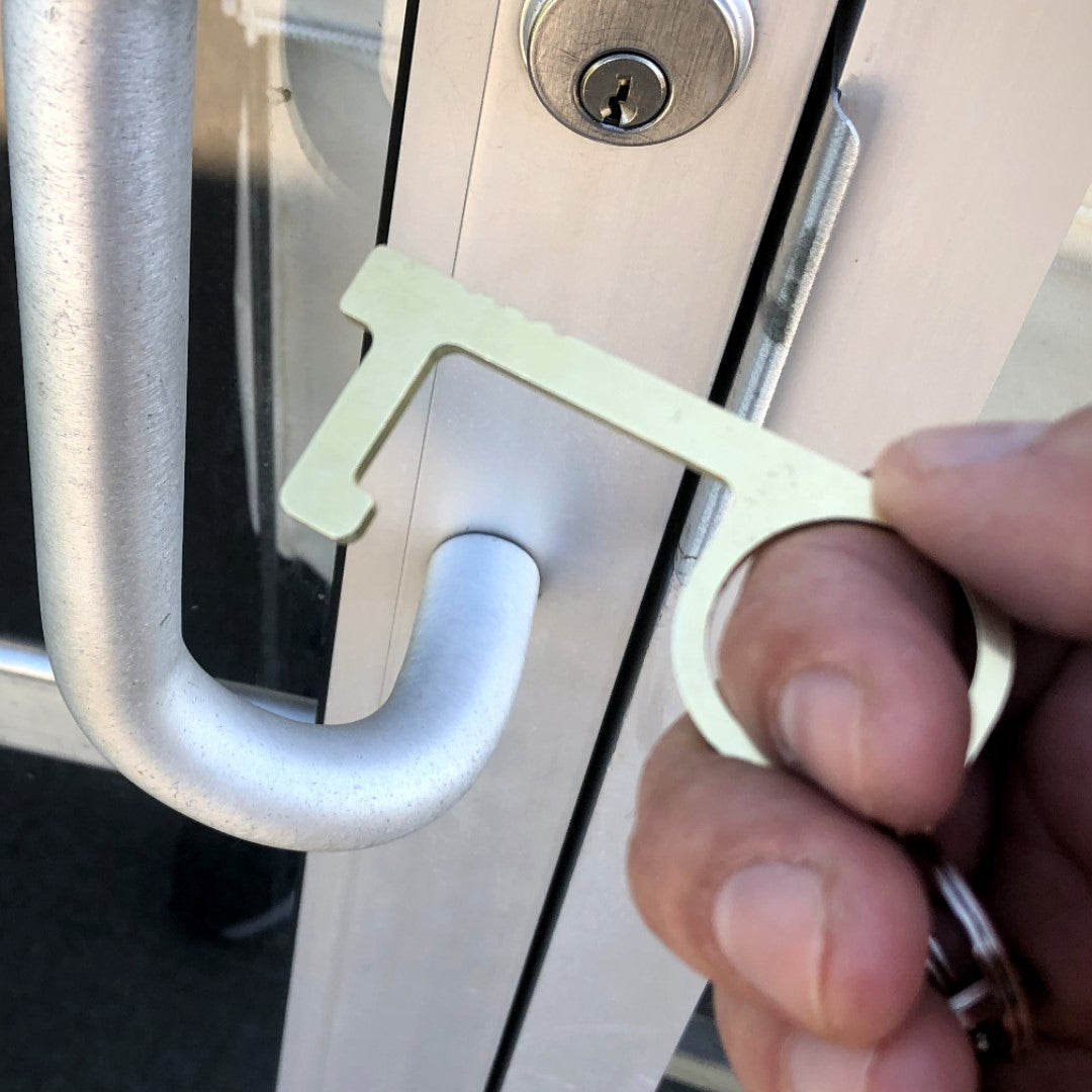 Copper Key Germ Free Door Opener being used to open a door