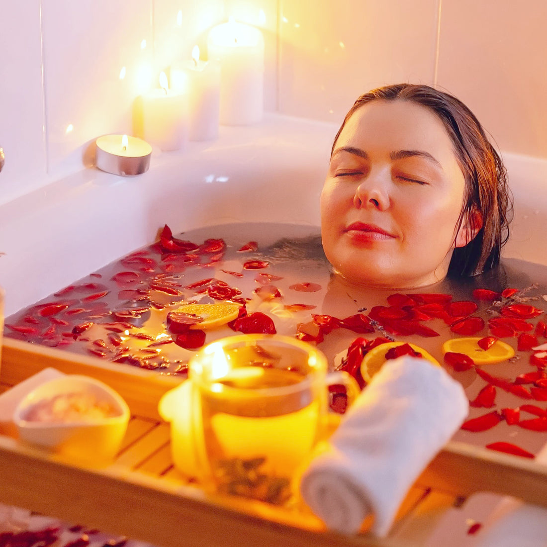 Relaxed woman enjoying scented candles