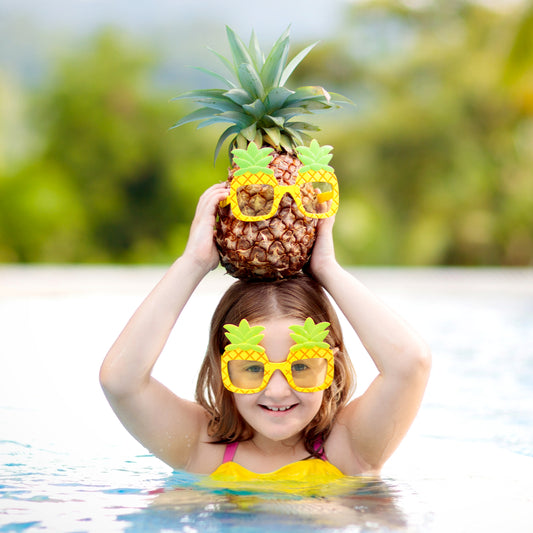 Funny girl with a pineapple on her head.