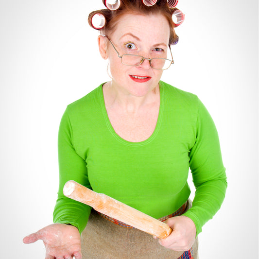 Lady holding a rolling pin. 