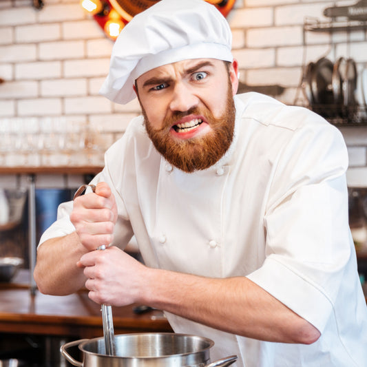 A chef using a spurtle