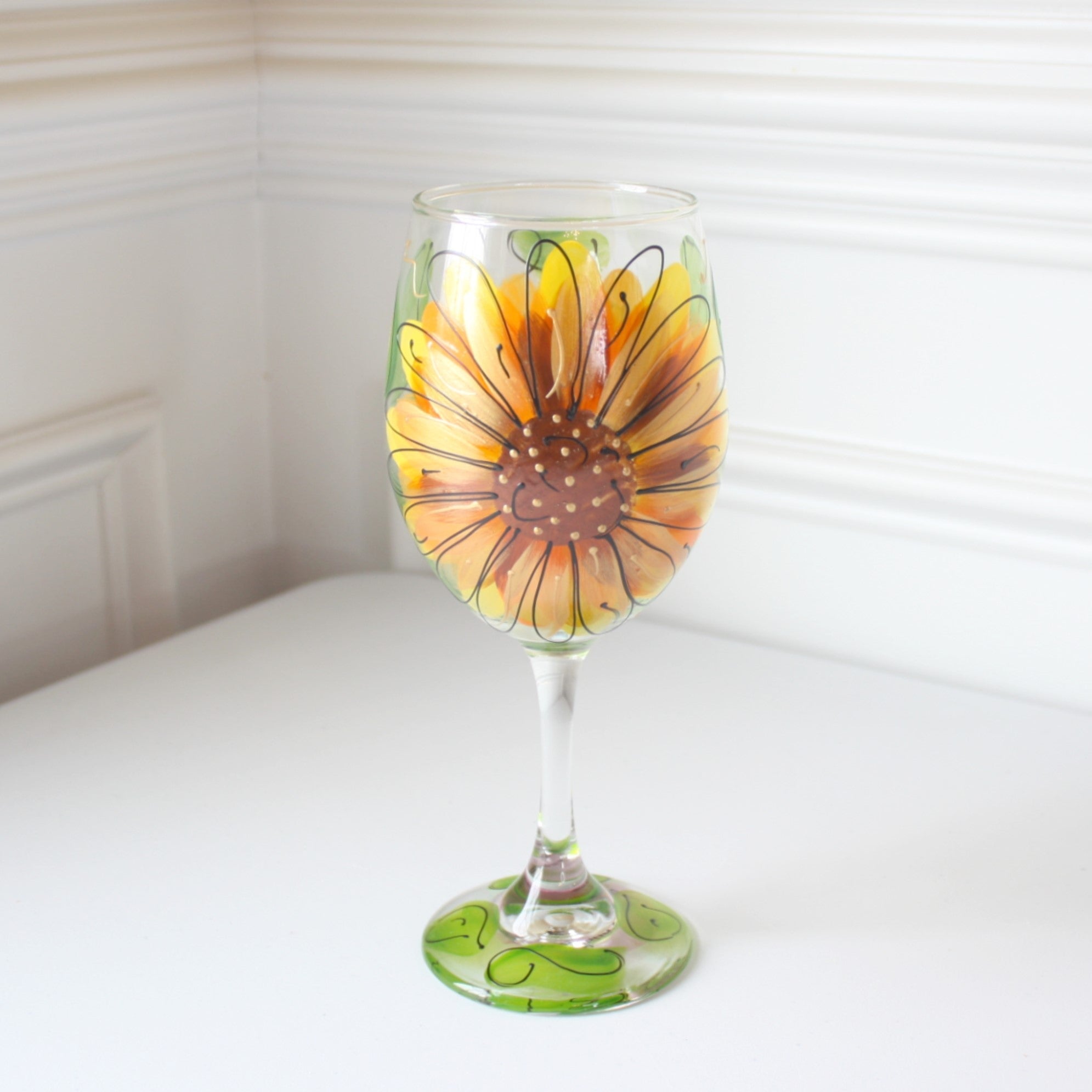 https://localwe.com/cdn/shop/products/sunflowerhandpaintedwineglass1.jpg?v=1669781212